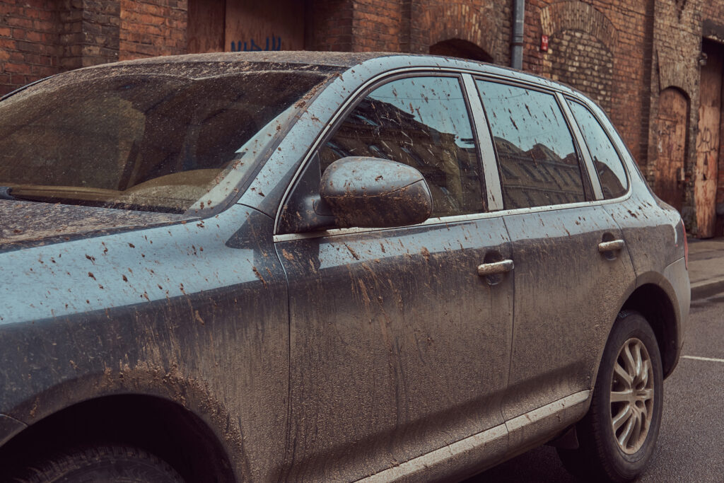 Close Up Image Of A Dirty Car After A Trip Around The Countryside